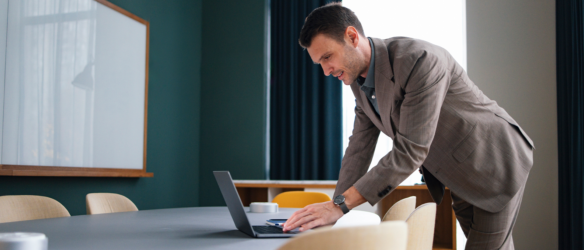 Anywhere 365 header image male worker in boardroom