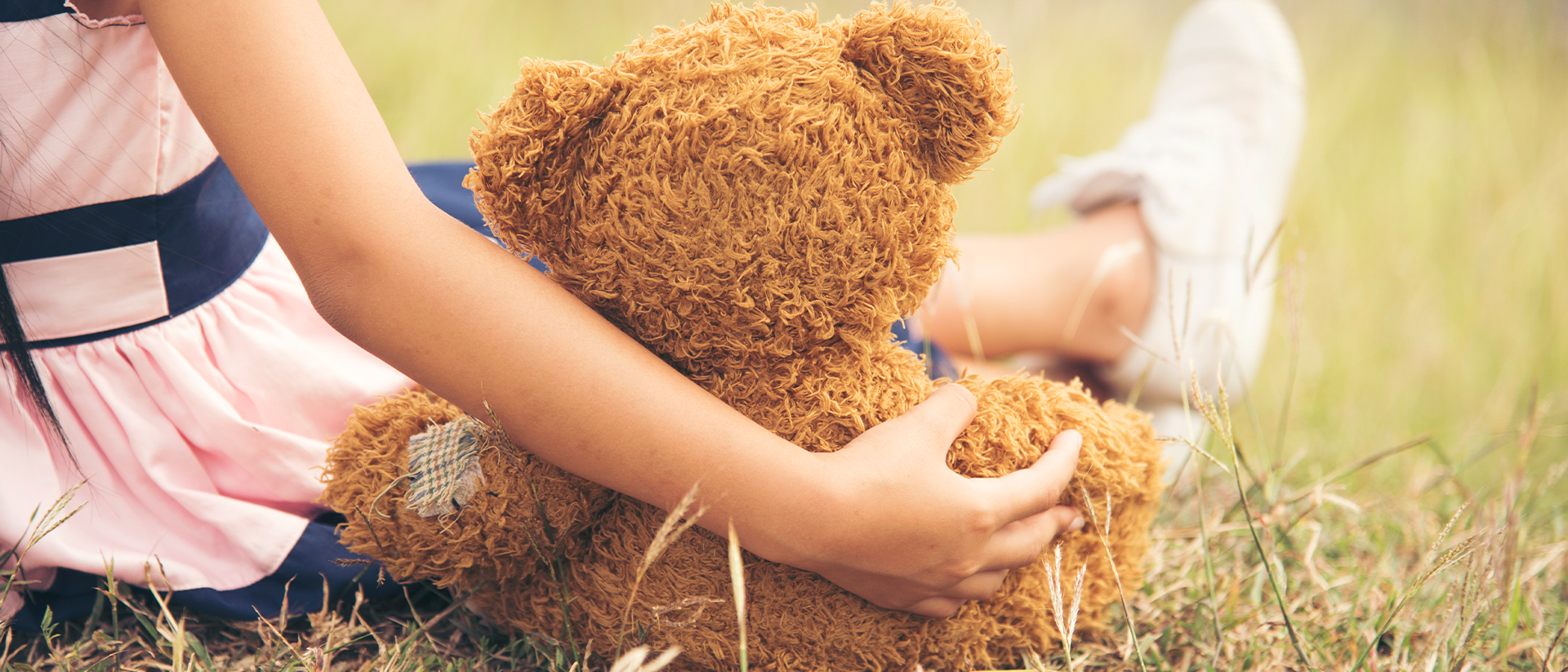 Spread a smile Header 1 Girl with teddy bear