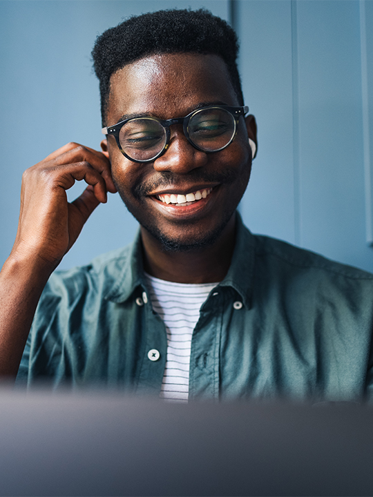 Anywhere 365 Portrait 2 man with earphones smiling